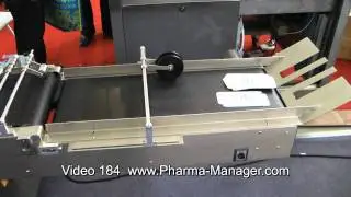 Labeling machine, gluing of labels on cardboard boxes. Video 184 www.Pharma-Manager.com