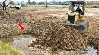 Amazing work Bulldozer Komatsu Push soil filling land with Dump truck pouring soils 