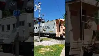 CSX caboose on main line train on local track