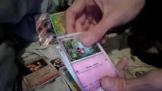 Pokemon tin opening first on team rocket Nidoking and Iron Treads also qr code give away