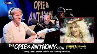 Sandy Kane's broken camera and showing off twatto on Opie and Anthony(2005)