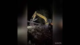 Excavator recovery from a ditch that leads to pike lake in Warsaw Indiana