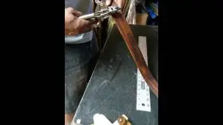 Making a leather beer bottle cap belt.