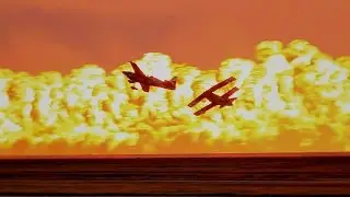 Two stunt planes and a wall of fire!