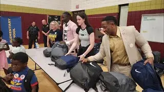 Caitlin Clark visits Iowa school for charity event