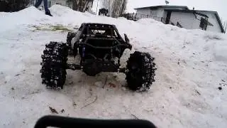 Axial Yeti Score Bomber & SMT10 racing on small snow and ice track