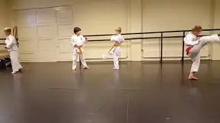 Legs warming up kids Hwa Rang class in Tang Soo Do