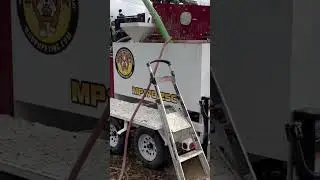 Drilling a water well using mud rotary.