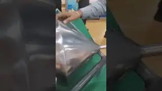 Double-ended cone appears to roll uphill &mdash; but it's actually the center of gravity moving downward!