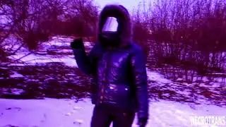 A girl in a blue ski overalls, a blue shiny jacket with hood + a panoramic gas mask with blue rubber