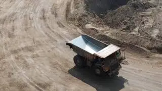 Caterpillar 777G Off-Highway Dump Truck traversing rough terrain to get loads