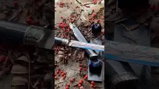 The author's tanto knife on a handmade stand