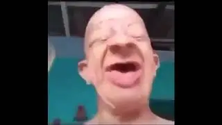 Bald guy drinking Orange juice