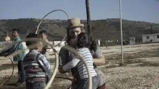 Music, games and sumo with kids in Greek refugee camp