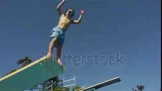 Boy Jumping From Springboard And Diving In Swimming Pool  Slow Motion  For Videos About  Swimming, P