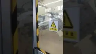 Full servo two piece structure baby pull up baby pant making machine with automatic stacker.