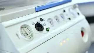 Medical device control panel displaying gauges and indicator lights in clinic