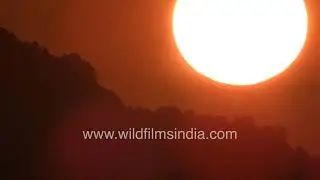 Golden sunrise over peaceful foothills of the Himalayas