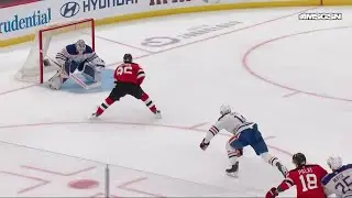 Jack Hughes scores a goal against the Edmonton Oilers