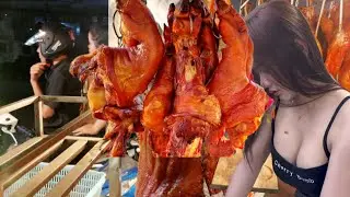 Very friendly seller shows off his classy street roasting pig chopping skills
