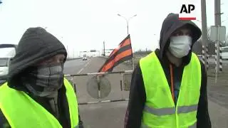 Pro-Russian self defence groups organise check points at entrances to Donetsk
