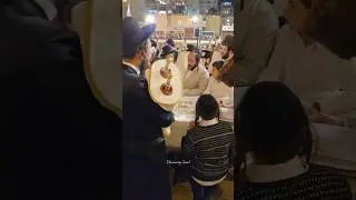 Jews celebrate the Simchat Torah holiday at the Western Wall in Jerusalem, Israel, in 2025