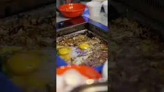 Cracking eggs onto the grill