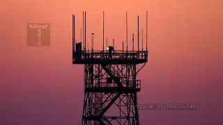 Stock Video: Airport Rotating Light Beacon Tower in the Evening