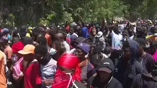 Gunfire as thousands protest in Haiti a surge of gang violence.
