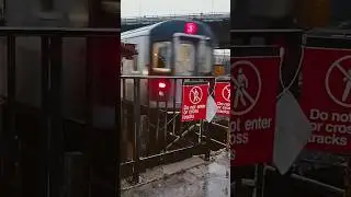 Rainy (2) train departure from 180th Street