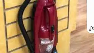 dirt Devil handvac. royal 1994 . on a red bathroom rug. claen