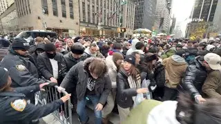 Crowds STORM Times Square NYE Gates, Push Down + Man Shows Pack of Diapers