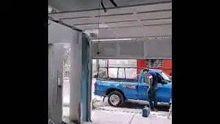 puerta ascendente de garage fabricada en herrer&iacute;a