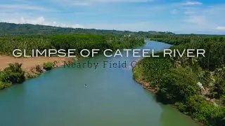 GLIMPSE OF CATEEL RIVER AND NEARBY FIELD CROPS