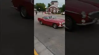 Saleen SN95 Mustang, 15 Shelby GT-H, Volvo P1800, Austin Healey leaving Elkhart Lake Concours