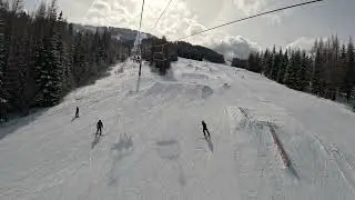 High speed quad chair lift over the terrain park at 49&deg; degrees north