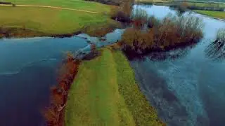 Drone over old quarry frozen lakes.