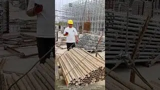 Tower Crane Lifts Pipes from Forklift as Ground Guide Signals by Radio