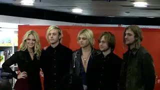 The R5 band at a signing at la Fnac store in Paris