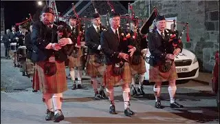 Comrie Pipe Band march in playing Col Forbes of Corse in Comrie for Bonfire Night Celebrations 2021