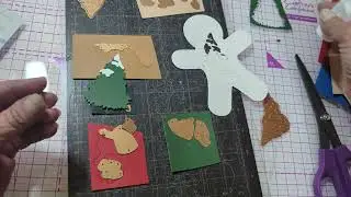 Используя маленький штамп Spellbinders на октябрь 2025 года, создайте милую рождественскую открытку.