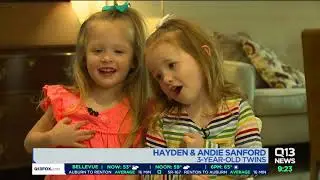 Ellen Tailor talks to a pair of 3 year old twins about Mother's Day
