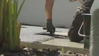 Installation of an outdoor stone carpet surface by ELNIA