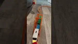 Simple wooden track with Ikea trains hauling freight and Thomas