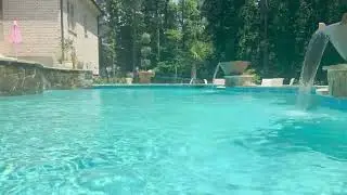 Elegant Aqua Serenity  Pool Level Tanning Ledge View