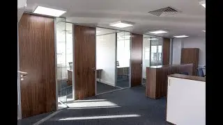 Single Glazed Partitions with full height walnut doors
