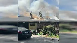 Truck 302 venting a residential structure fire