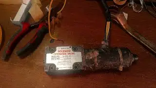 Repairing back hoe swing motor SOLENOID VALVE 