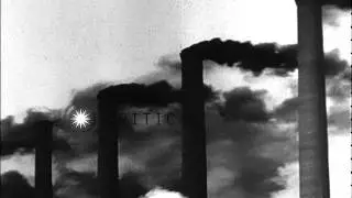 Steel Mill and Town. Smoke, ash, soot, fumes, dirt, molten iron, wooden sidewalks...HD Stock Footage