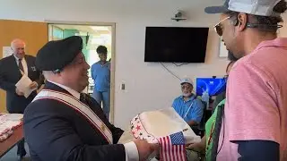 Knights of Columbus award veterans with handmade quilts